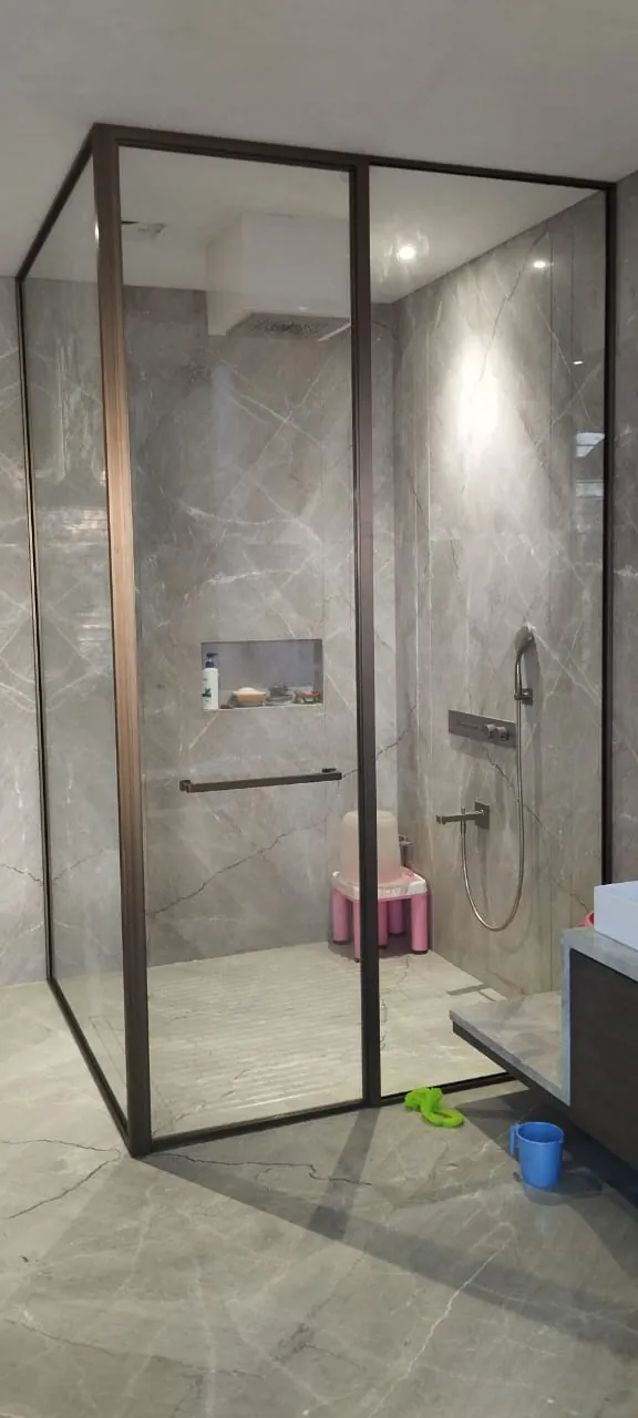 Bronze corner shower, grey marble