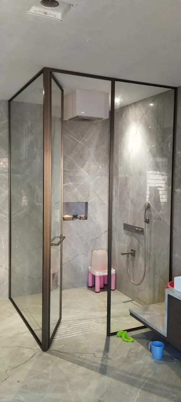 Bronze corner shower, door open